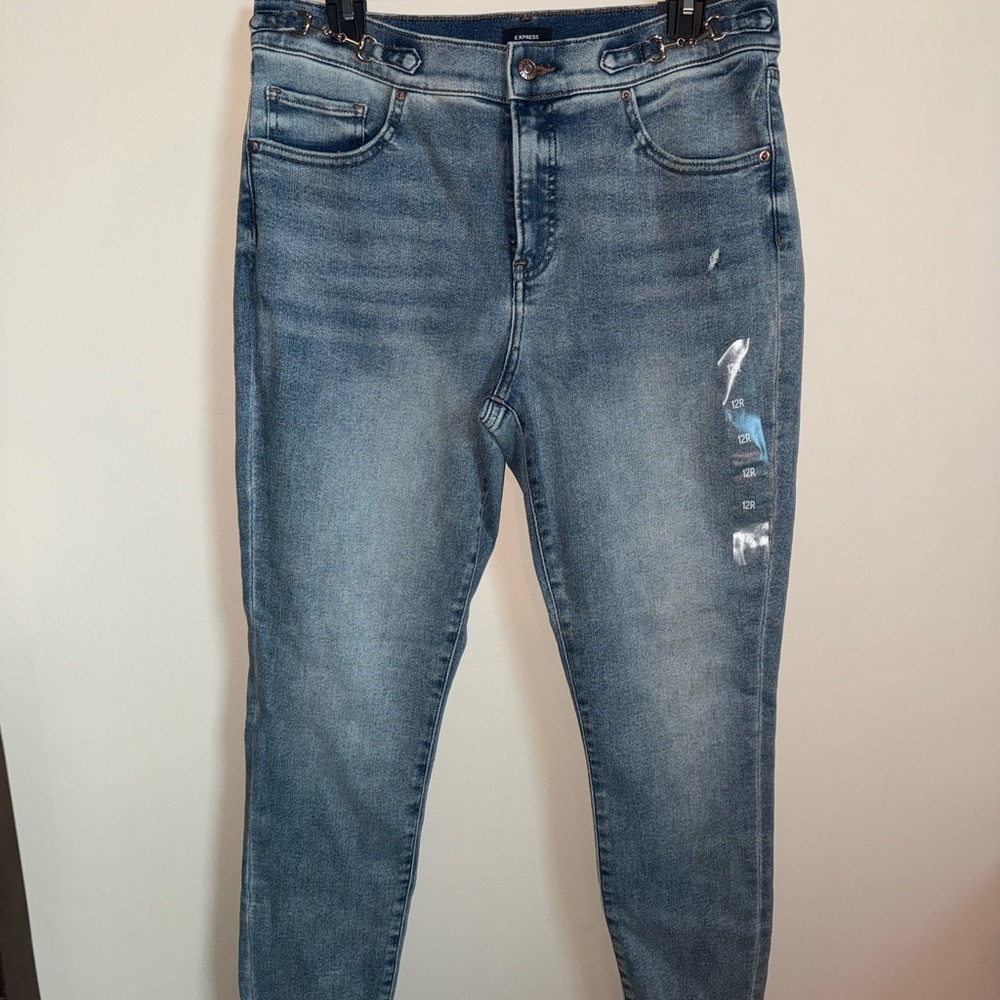 NWT Express Women’s Mid Rise Blue Jeans with metal buckles size 12